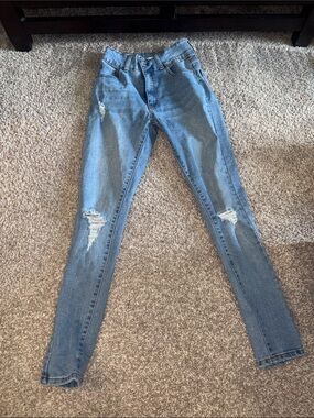 Light blue ripped skinny jeans